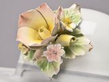 a white cake with a flower decoration on top of it