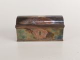 an image of a small metal box sitting on top of a table