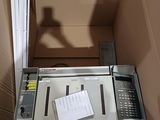 a box that has a machine in it and a phone in it