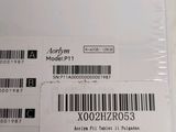 a label on the back of a laptop with a barcode on it