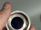 a person holding a metal object in their hand