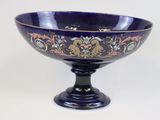 a blue bowl with a floral design on it