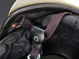 a close up of a helmet with a strap on it