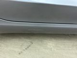 a close up of a car ' s front bumper with a dent on it