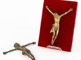 an image of a crucif with a red velvet case and a cross