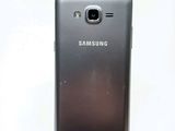 a close up of a cell phone on a white surface