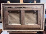 an old wooden easel with a piece of paper on top of it