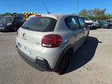 a small car that is parked in a parking lot
