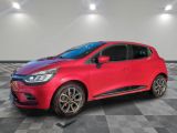 a red car parked in a garage with a checkered floor