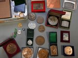 a lot of coins and other items that are on the table