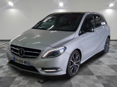 the mercedes b - class is parked on a checkered floor