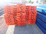 many crates of orange and blue crates on the ground