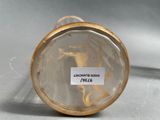 a close up of a glass vase with a label on it