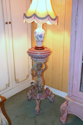 a lamp that is sitting on a table in a room