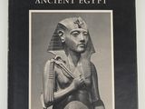 an old black and white photo of a statue of an egyptian man