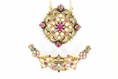 an image of a necklace and earring set with pink stones