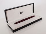 a picture of a pen in a box on a white surface