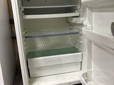 an open refrigerator that is sitting in a kitchen