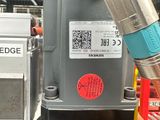 a close up of a machine that has a hose attached to it