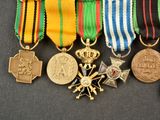 a group of medals and medals on display on a table
