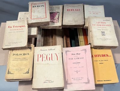 several books are stacked on top of each other on a table