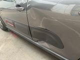 a close up of a car ' s door handle and door handle