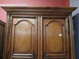 an image of a wooden armoire in a room