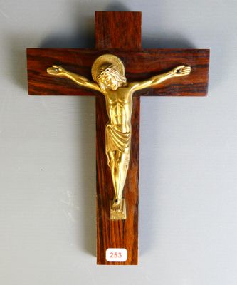 wooden crucif with a gold jesus on the cross