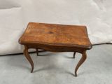 an image of a small table with a wooden top and legs
