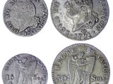 four different types of silver coins on a white background