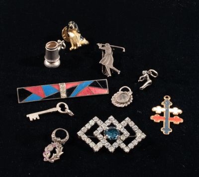 several different types of jewelry are displayed on a black surface