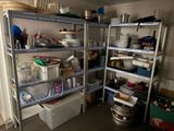 a room with a bunch of shelves and containers on it