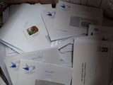 a bag full of envelopes sitting on a table
