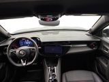 a view of the inside of a car from the driver ' s seat