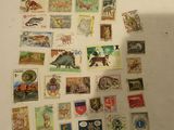 a lot of stamps that are on the table