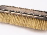a brush that is sitting on top of a table