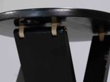 a black table with a cell phone on top of it