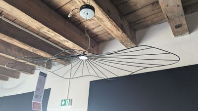 a light that is hanging from the ceiling in a room