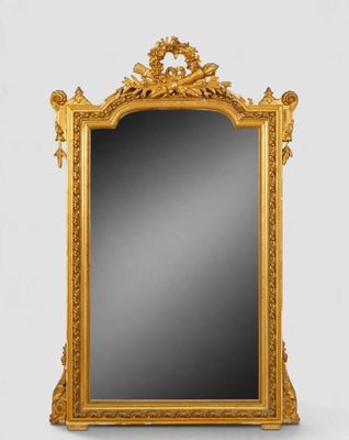 un miroir à cadre doré orné d'un motif représentant un oiseau et une fleur