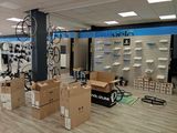 a room with many boxes and bikes in it