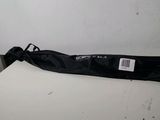 a black umbrella sitting on a table in a room