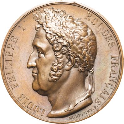 une image représentant une médaille de bronze sur laquelle figure la tête d'un homme