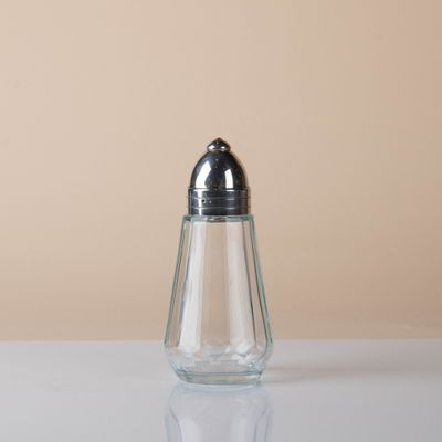 a salt and pepper shaker sitting on a table