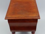 an old wooden table with a drawer on top of it