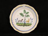 a plate with a picture of a deer and a dog on it