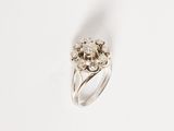an image of a diamond ring on a white surface