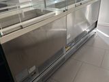 a glass display case in the middle of a room