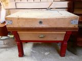 an old suitcase sitting on top of a wooden table