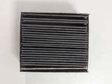 an image of a black air filter on a white surface