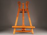 an old wooden easer with two legs on a gray background